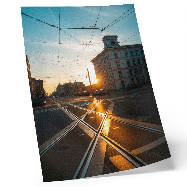 Plakatas Besileidžianti saulė virš miesto su architektūra