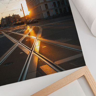 Plakatas Besileidžianti saulė virš miesto su architektūra