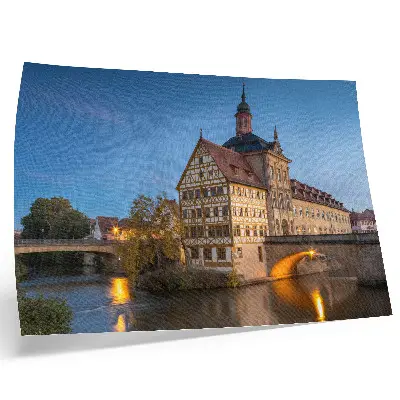 Plakatas ant drobės istorinis pastatas, tiltas, vanduo ir mėlynas dangus