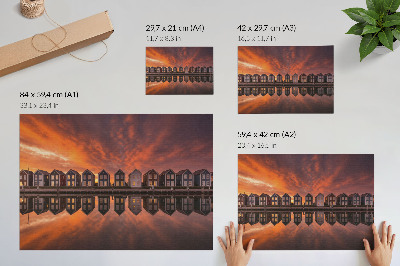 Plakatas ant drobės Spalvingi nameliai prie vandens saulėlydžio šviesoje