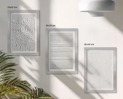Įrėmintų paveikslų rinkinys su ryškiais stygų struktūrų raštais smėlyje