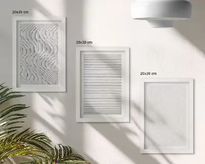 Įrėmintų paveikslų rinkinys su ryškiais stygų struktūrų raštais smėlyje